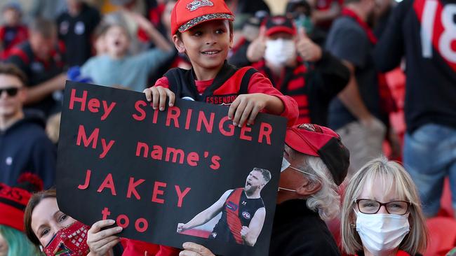 Fans show support for Jake Stringer and his Bombers teammates at Metricon Stadium. Picture: Getty Images