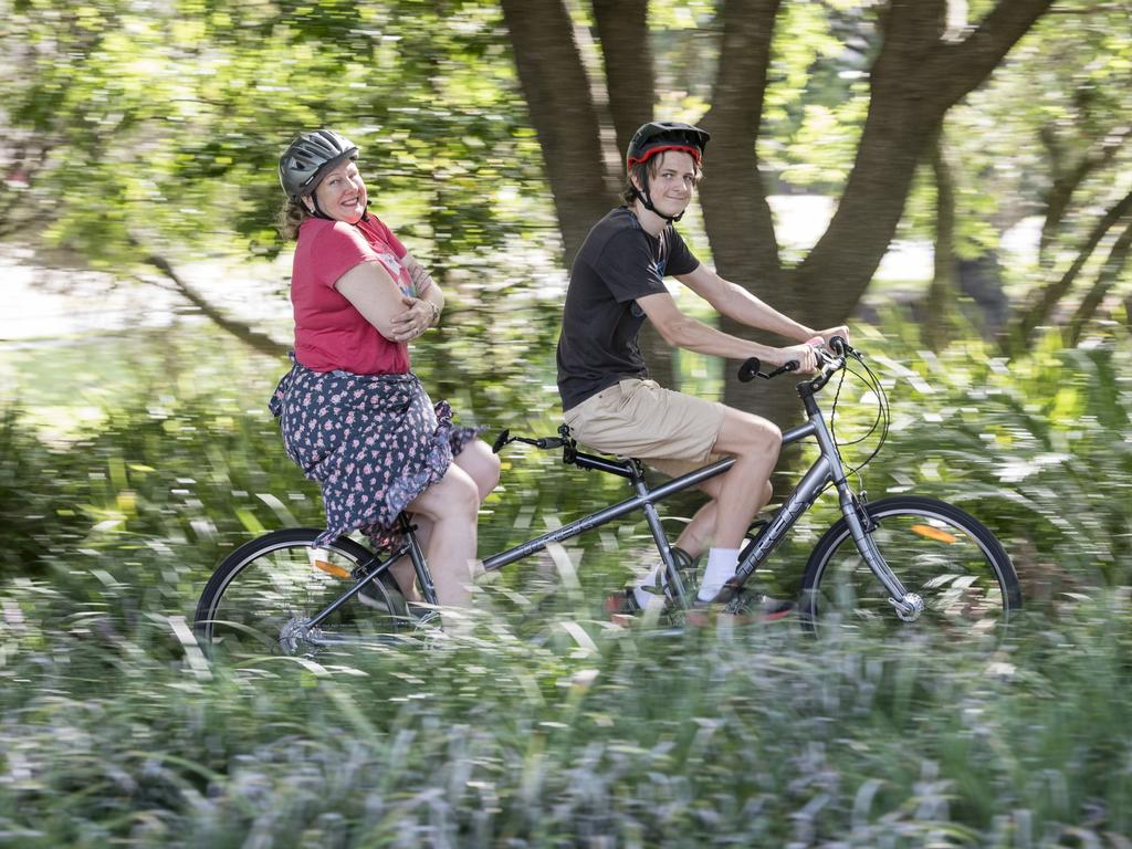 Riding a tandem bike are Leanne Reynolds and son Harry Reynolds on the Community Bike Ride. Picture: Kevin Farmer