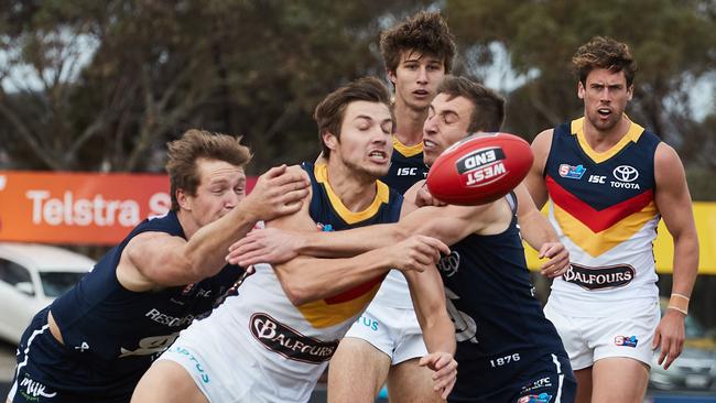 Samuel Overall tackling Corey Davey during his time at the Crows. Picture: Matt Loxton