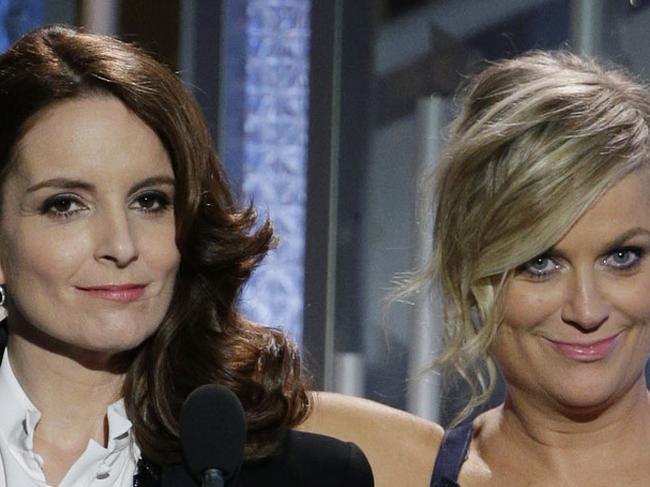 BEVERLY HILLS, CA - JANUARY 11: In this handout photo provided by NBCUniversal, Hosts Tina Fey and Amy Poehler speak onstage during the 72nd Annual Golden Globe Awards at The Beverly Hilton Hotel on January 11, 2015 in Beverly Hills, California. (Photo by Paul Drinkwater/NBCUniversal via Getty Images)