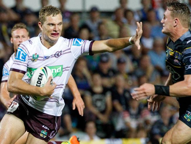Sea Eagles Tom Trbojevic fends off Cowboys Coen Hess during the Round 3 NRL match between the North Queensland Cowboys and the Manly-Warringah Sea Eagles at 1300SMILES Stadium in Townsville, Saturday, March 18, 2017. (AAP Image/Michael Chambers) NO ARCHIVING, EDITORIAL USE ONLY