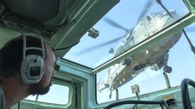 Royal Australian Navy officer Lieutenant Edward Costigan watches as an Indian Navy Sea King helicopter prepares to land on HMAS Parramatta’s flight deck earlier this year. Picture: Supplied