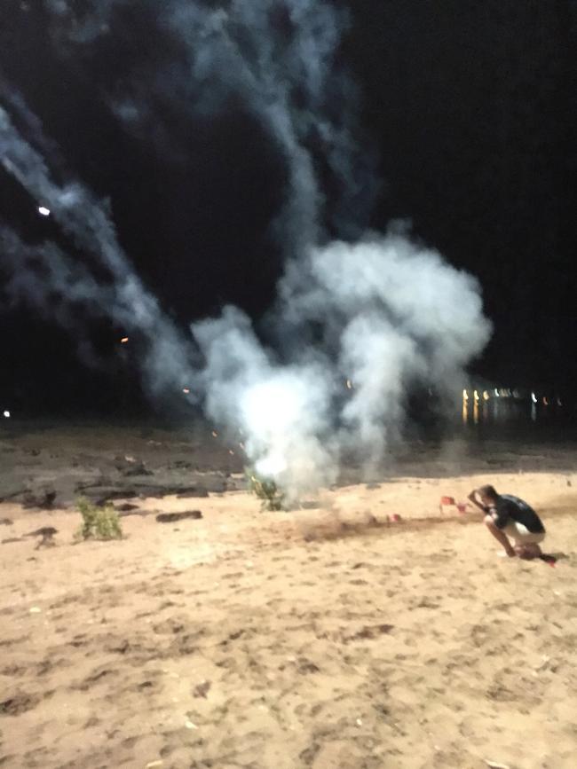 Revellers setting off fireworks at East Point Beach. Picture: Lucy Moore