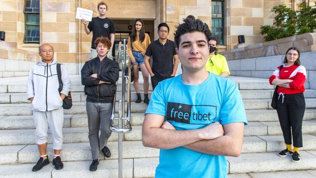 University of Queensland student Drew Pavlou protests the front of the university’s Forgan Smith Building yesterday. Picture: Richard Walker