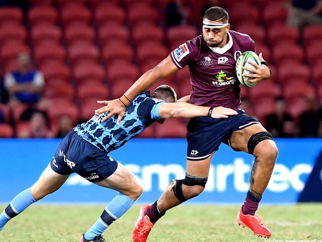 BRISBANE, AUSTRALIA - MARCH 14: Lukhan Salakaia-Loto of the Reds takes on the defence during the round seven Super Rugby match between the Reds and the Bulls on March 14, 2020 in Brisbane, Australia. (Photo by Bradley Kanaris/Getty Images)