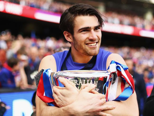 MELBOURNE, AUSTRALIA - OCTOBER 01: Easton Wood of the Bulldogs celebrates with the Premiership Cup after the 2016 Toyota AFL Grand Final match between the Sydney Swans and the Western Bulldogs at the Melbourne Cricket Ground on October 01, 2016 in Melbourne, Australia. (Photo by Ryan Pierse/AFL Media/Getty Images)