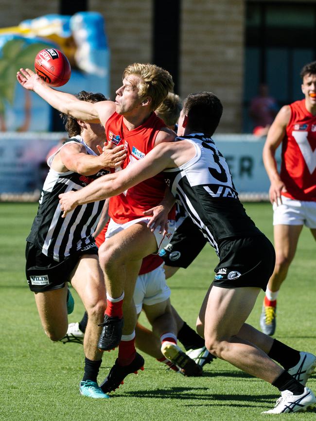 North Adelaide’s Maris Olekalns runs into a Port Adelaide brick wall at Alberton. Picture: AAP Image/ Morgan Sette