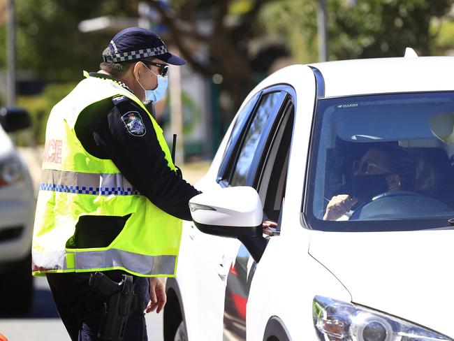 Police maintain their watch at the Queensland NSW border in Coolangatta. Picture: Adam Head