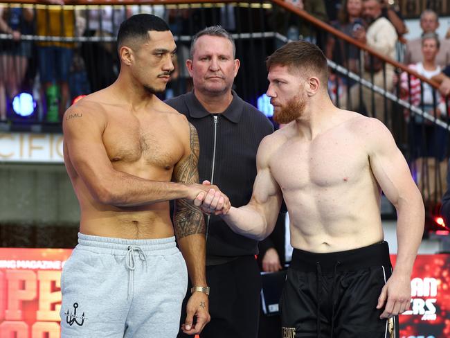 Jai Opetaia and Claudio Squeo face off during the weigh-in. Picture: Chris Hyde/Getty Images