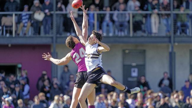 Riley Linke (right) in full flight for Caulfield Grammar. Picture: Valeriu Campan