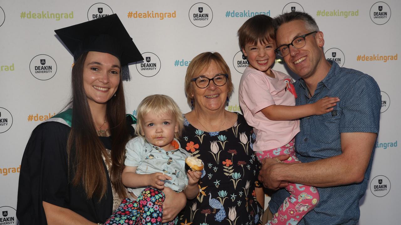 Vanessa George with Eugene, Hugh Harvey with Lawrence and Megan George. Deakin School of Education; NIKERI; and Centre of Humanitarian Leadership students graduated on Wednesday lunchtime. Picture: Alan Barber