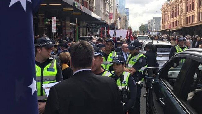 Police in Melbourne surround descendants of Serbian war veterans in the CBD on Thursday. The Serbians claim they were prevented from marching on Anzac Day due to alleged links to the Christchurch shootings.
