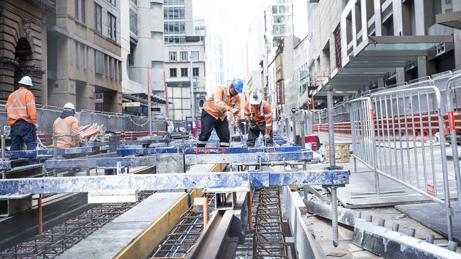 Light rail workers between George St and Martin Place. Picture: Flavio Brancaleone