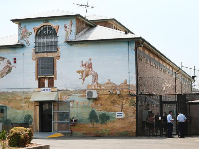 Guards outside an exercise area of one the prison blocks at Long Bay.Picture: Richard Dobson