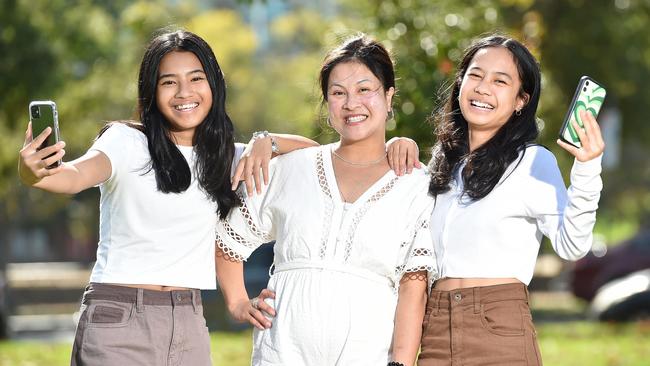 Daejia and Tia Porima, pictured with Ana, monitor their own screen time at night. Picture: Nicki Connolly