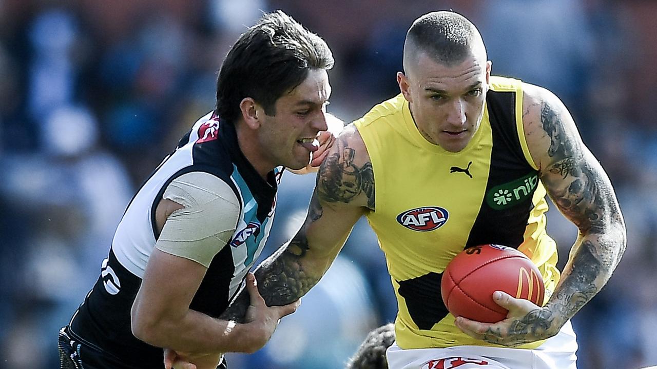 ADELAIDE, AUSTRALIA - AUGUST 27: Dustin Martin of the Tigers competes with Zak Butters of Port Adelaide during the round 24 AFL match between Port Adelaide Power and Richmond Tigers at Adelaide Oval, on August 27, 2023, in Adelaide, Australia. (Photo by Mark Brake/Getty Images)