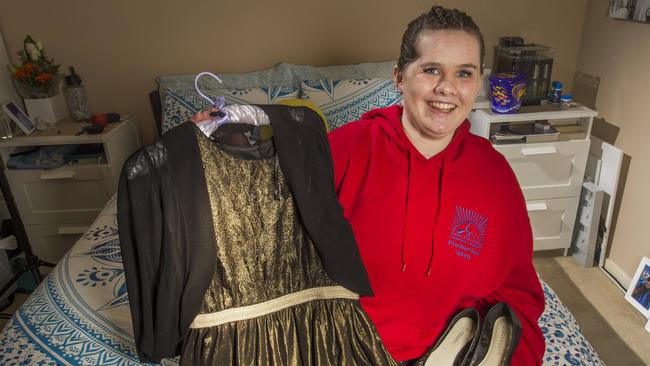 Natalee Wood holds her graduation dress. Picture: Rob Leeson.