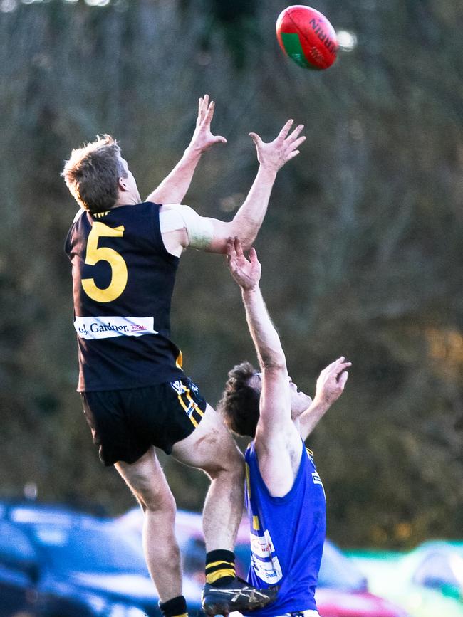 Springbank's Nick Couch soars over Learmonth's Brenton Powell in 2016. A premiership has been out of reach for the Lakies since it entered the Central Highlands Football League in 1979. Picture: Aaron Cook