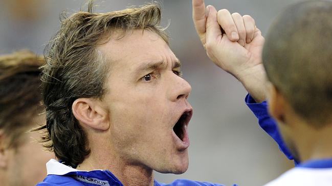 Dean Laidley calls the shots during his days at North Melbourne.