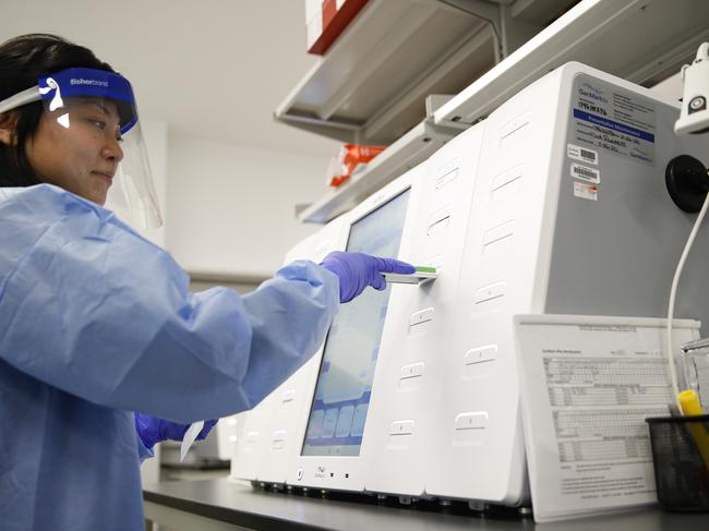 A laboratory technician prepares COVID-19 patient samples for semiautomatic testing at a lab in New York. Picture: AP