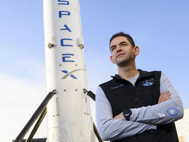 (FILES) Inspiration4 mission commander Jared Isaacman, founder and chief executive officer of Shift4 Payments, stands for a portrait in front of the recovered first stage of a Falcon 9 rocket at Space Exploration Technologies Corp. (SpaceX) on February 2, 2021 in Hawthorne, California. US President Donald Trump is planning to withdraw his nomination of tech billionaire Jared Isaacman, a close ally of Elon Musk, to lead space agency NASA, the White House said May 31, 2025. (Photo by Patrick T. FALLON / AFP)
