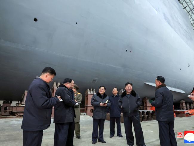 North Korean leader Kim Jong-un (C) inspecting a shipbuilding project at a major shipyard at an undisclosed location in North Korea. Picture: KCNA VIA KNS/AFP