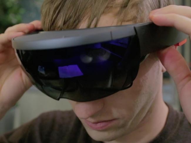 A student tries on Microsoft HoloLens