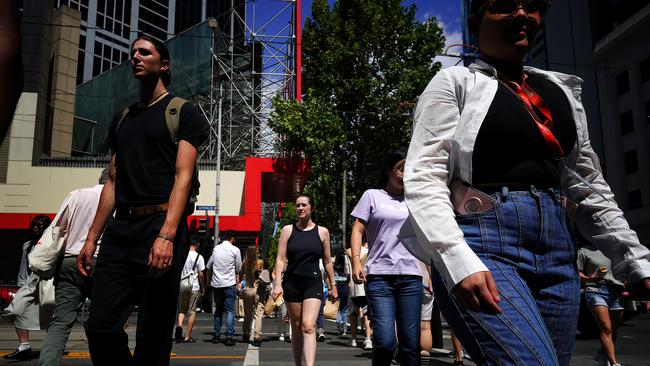 MELBOURNE, AUSTRALIA - NewsWire Photos 17 FEBRUARY, 2023:  People are seen while walking during a heat wave at MelbourneÃ¢â¬â¢s CBD.Picture: NCA NewsWire / Luis Ascui