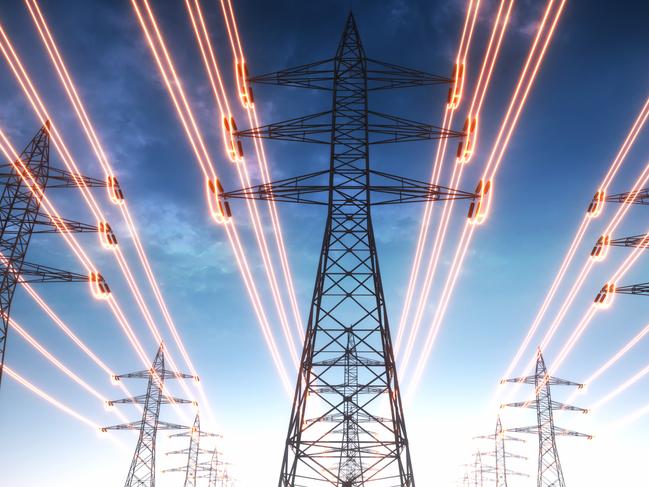 High voltage transmission towers with red glowing wires against blue sky - Energy concept