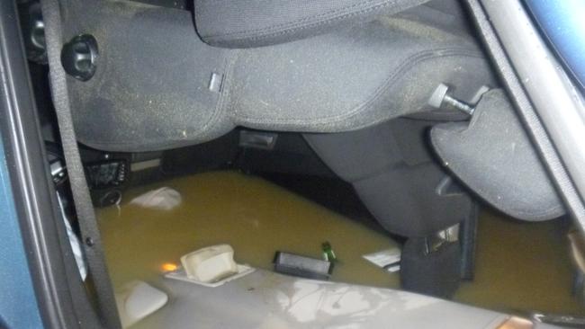 Inside the partially submerged car.