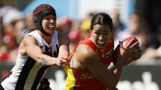 MELBOURNE, AUSTRALIA - SEPTEMBER 27: Brittany Bonnici of the Magpies tackles Lucy Single of the Suns during the round five AFLW match between Collingwood Magpies and Gold Coast Suns at Swinburne Centre, on September 27, 2024, in Melbourne, Australia. (Photo by Darrian Traynor/Getty Images)