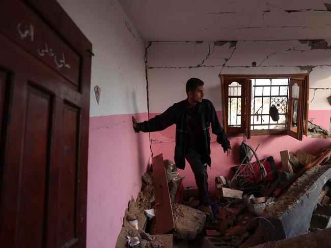 A man inspects the damage at the site of an Israeli strike that targetted an area in Khan Yunis on the southern Gaza Strip on Friday. Picture: AFP