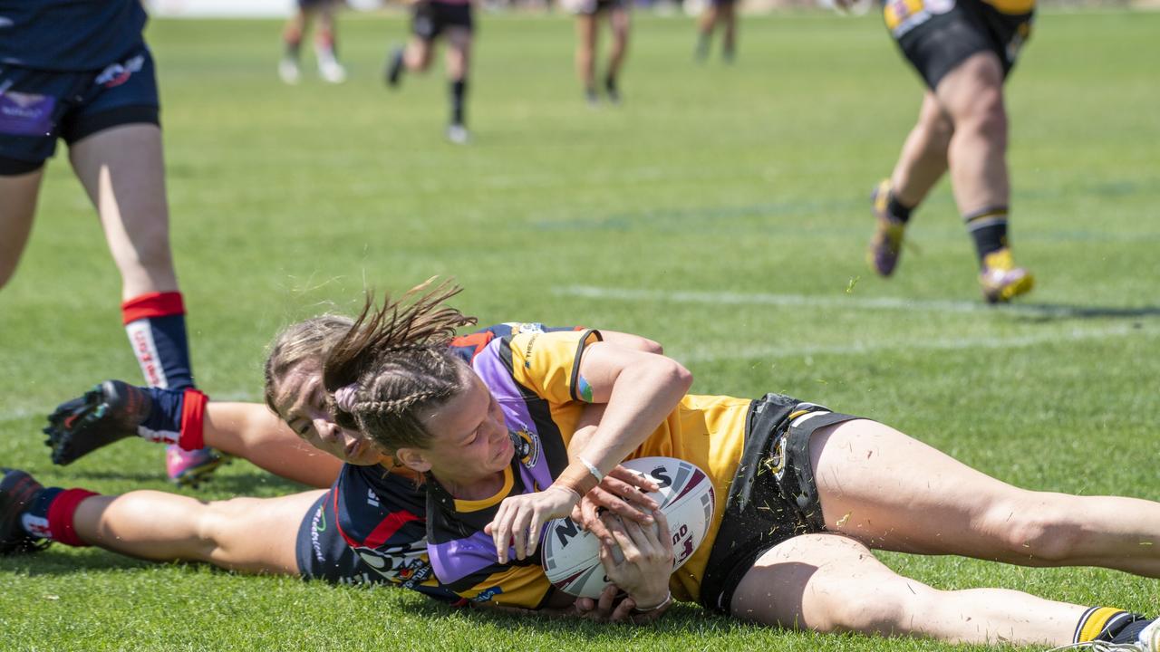 Warwick's Jordan McGrath tackles Ellen Nussey from Gatton. Warwick vs Gatton. 2021 TRL women's final. Sunday, September 19, 2021. Picture: Nev Madsen.