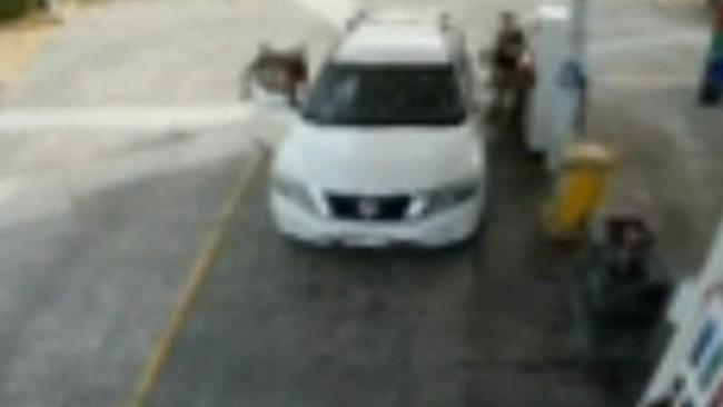 A man allegedly enters the vehicle as the children’s father pumps gas. Picture: 9News