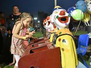 GAME OF SKILL: Fun times at the St John's Moonlight Fair on Friday night. Picture: Jorja McDonnell