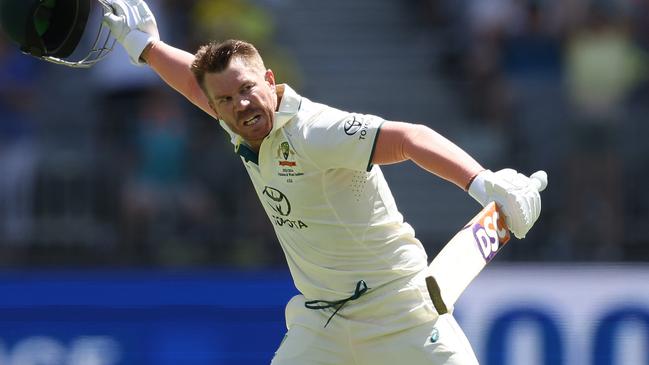 PERTH, AUSTRALIA - DECEMBER 14: David Warner of Australia celebrates after scoring a century during day one of the Men's First Test match between Australia and Pakistan at Optus Stadium on December 14, 2023 in Perth, Australia. (Photo by Paul Kane/Getty Images)