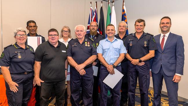 Queensland Fire Department Australia Day Achievement Award recipients with QSuper regional manager Mark Haines (in black) and Townsville MP Adam Baillie (far right). Picture: Supplied