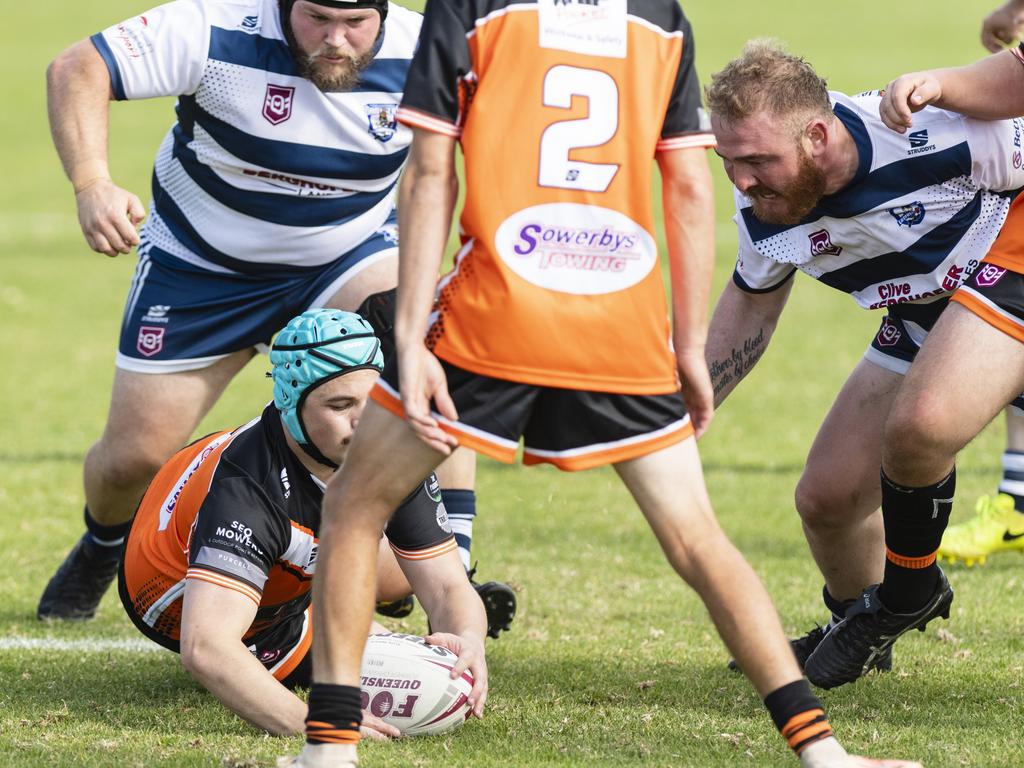 Alec Curtis gets on a loose ball for Southern Suburbs.