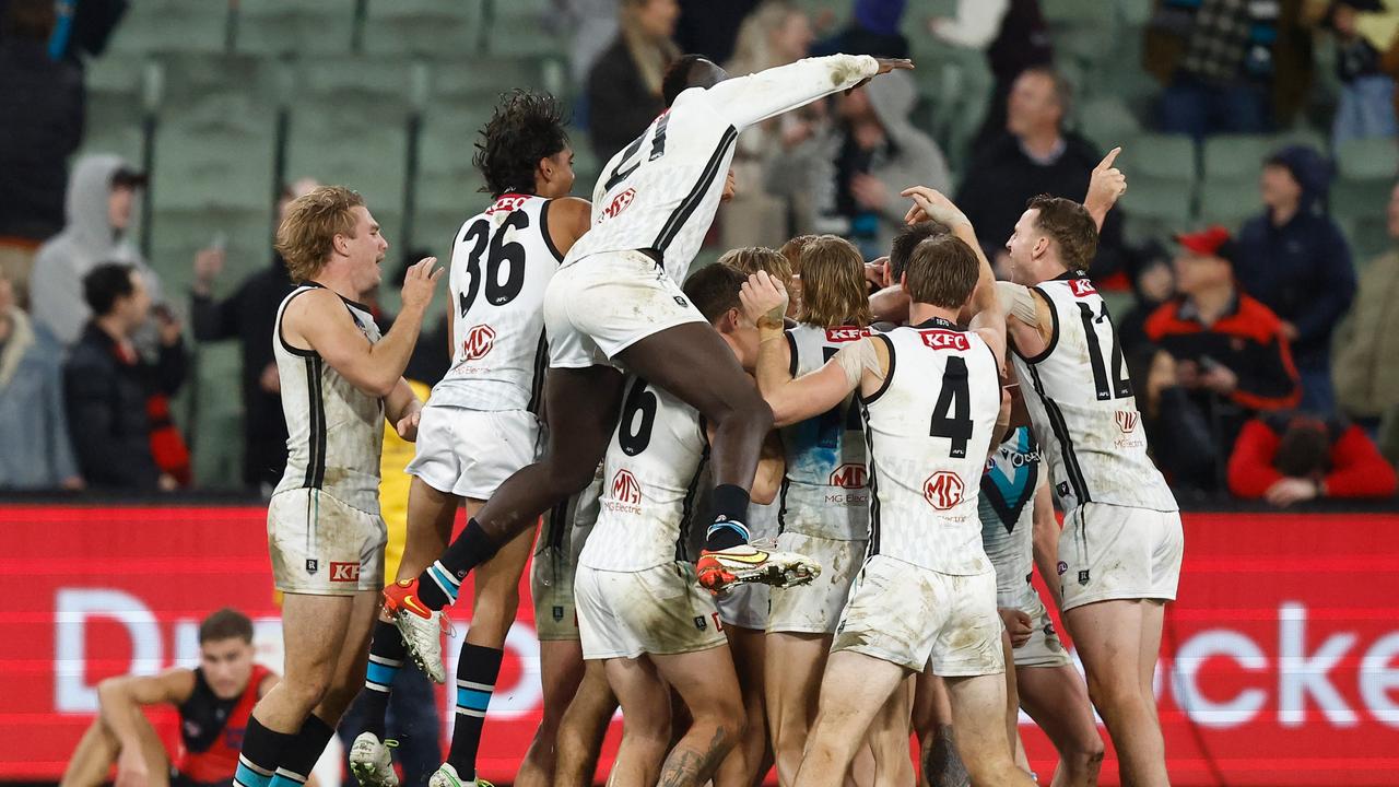 MELBOURNE, AUSTRALIA - JULY 01: Dan Houston of the Power celebrates a goal with teammates after the siren to win the match siren during the 2023 AFL Round 16 match between the Essendon Bombers and the Port Adelaide Power at the Melbourne Cricket Ground on July 1, 2023 in Melbourne, Australia. (Photo by Michael Willson/AFL Photos via Getty Images)