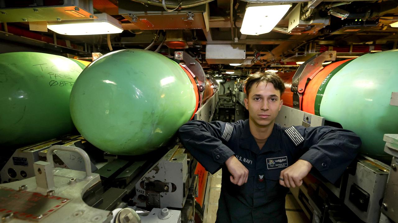 US navy Officer Devin Simpson, checks the MK 48 torpedos aboard the Virginia-class fast-attack submarine USS Minnesota during a port visit to HMAS Stirling. Picture: NewsWire/Pool/ Colin Murty