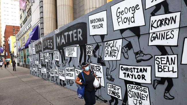 A woman walks past a Black Lives Matter mural in New York City. Picture: AFP