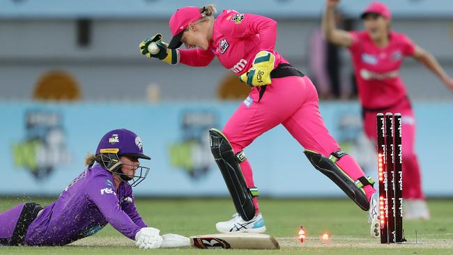 Alyssa Healy of the Sixers celebrates the run-out of Hobart’s Corinne Hall during the WBBL match at North Sydney Oval. Picture: MARK METCALFE/GETTY IMAGES