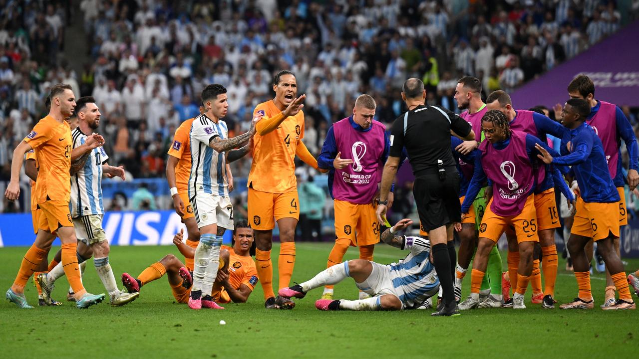 Virgil Van Dijk (centre) remonstrates with the referee after felling Leandro Paredes. (Photo by Matthias Hangst/Getty Images)