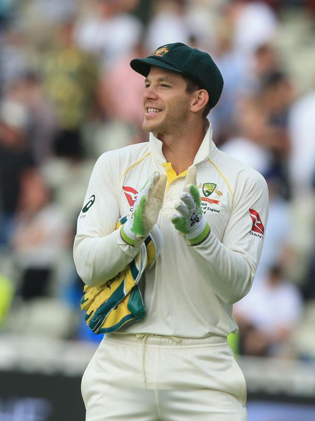 Tim Paine applauds his team from the field. Picture: Lindsey Parnaby/AFP)