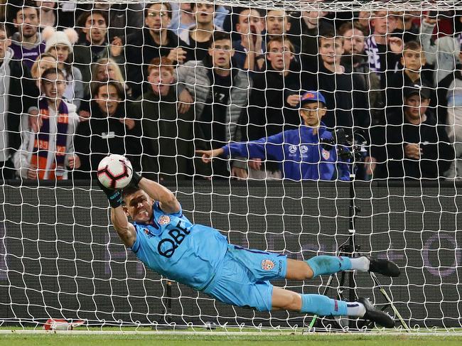 PERTH, AUSTRALIA - MAY 10:  Liam Reddy of the Glory takes a save from Papa Baba Diawara of the Reds at the penalty shoot out during the A-League Semi Final match between the Perth Glory and Adelaide United at HBF Park on May 10, 2019 in Perth, Australia. (Photo by Will Russell/Getty Images)