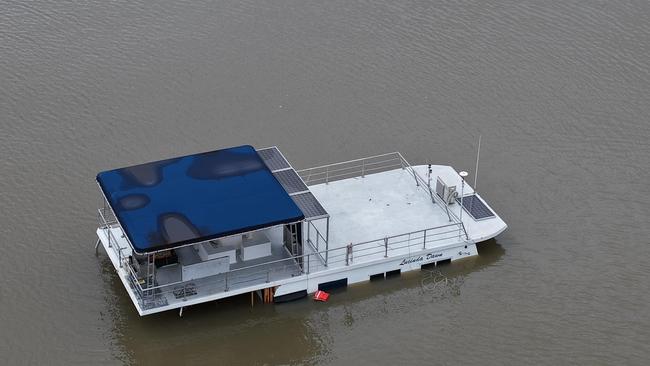 The houseboat Lucinda Dawn has sunk during this week's rain event and now lies on the bottom off the Cardwell beach. Picture: Jesse Rowe