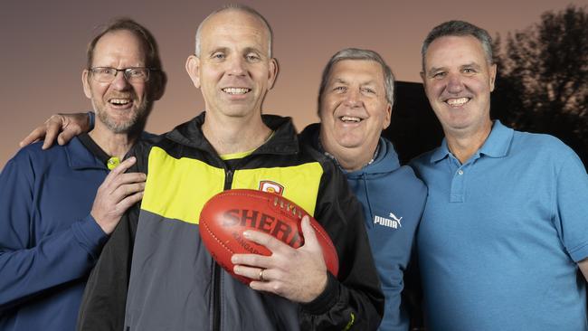 Field umpire Corey Bowen, who is umpiring his 400th game this week, alongside fellow 400-game umps Tim Pfeiffer(left) Laurie Argent and Richard Williams (right), and .2nd June 2025 Picture: Brett Hartwig.