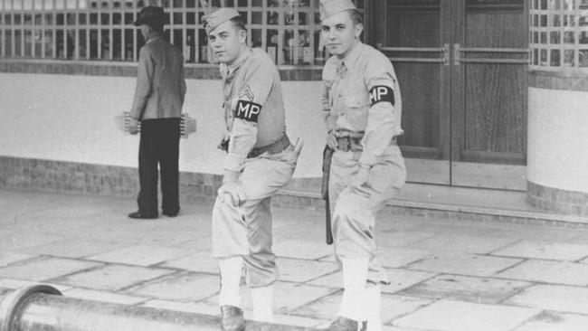 US military police outside the Central Hotel, Brisbane. Picture: Sunday Truth, Brisbane/State Library of Queensland.