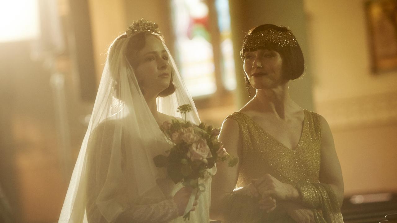 Dot, played by Ashleigh Cummings is walked down the aisle by Phryne, played by Essie Davis, in the season three finale of Miss Fisher's Murder Mysteries. Picture: Supplied.