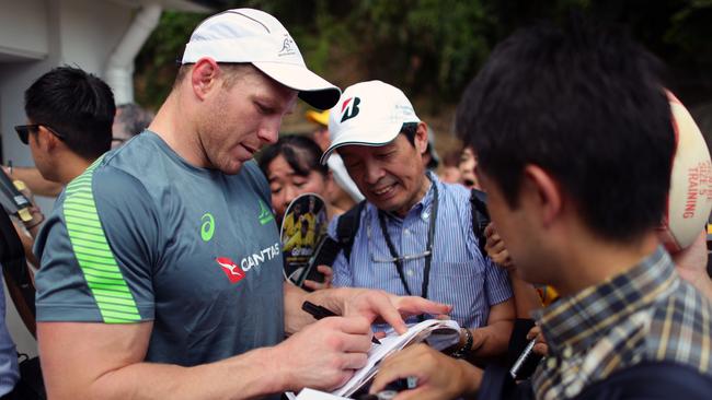 Flanker David Pocock signs autographs for fans in Japan. Picture: Getty Images